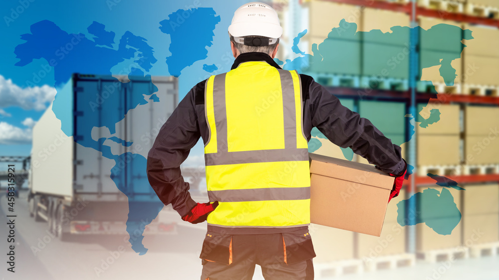 Logistic transportation concept. Man with box with his back to camera. Logistics business metaphor. Warehouse racks and truck in background. World map symbolizes international logistics.