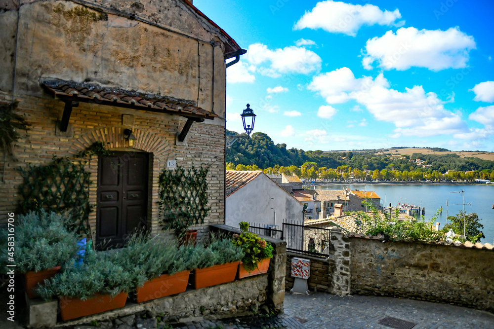 A narrow street in Anguillara sabazia, an old town in Lazio region, Italy. A narrow street in Anguillara sabazia, an old town in Lazio region, Italy.