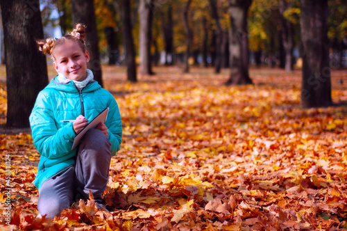 Girl in the autumn forest. Golden autumn.