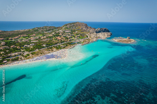 Aerial panoramic view of La Pelosa beach in Stintino, Sardinia with crystal clear turquoise water