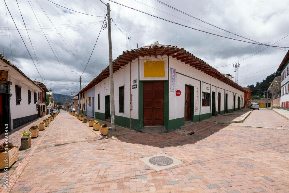 Nemocon, Cundinamarca, Colombia. July 2, 2021: Colorful facade and architecture of city houses.