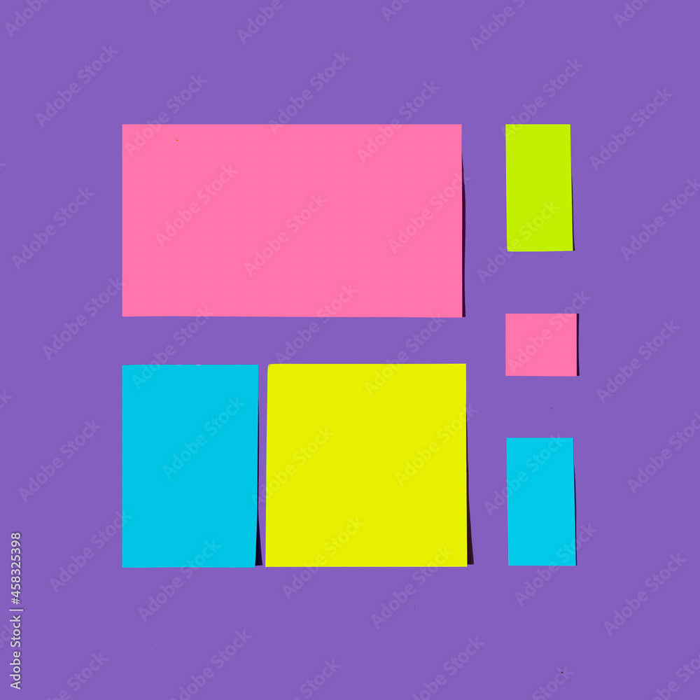 Colorful neon paper card notes in square shape against violet purple background. Copy space concept. Creative layout. Colorful neon paper card notes in square shape against violet purple background. Copy space concept. Creative layout.