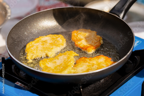 Fried potato pancakes in a pan