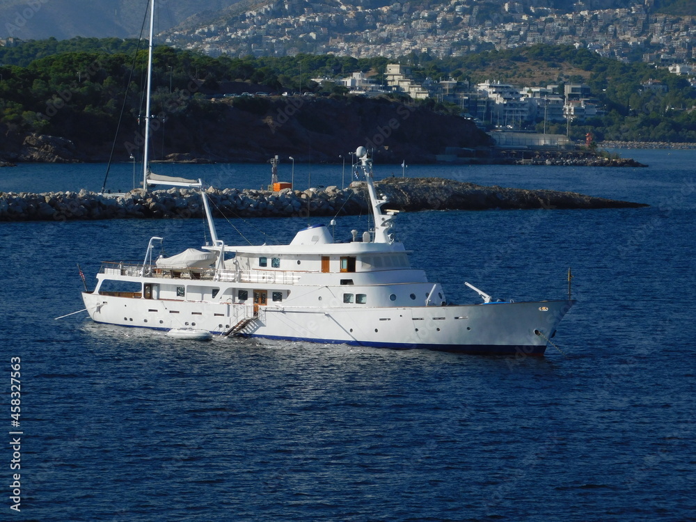 A luxury yacht near the coast of Vouliagmeni in Attica, Greece