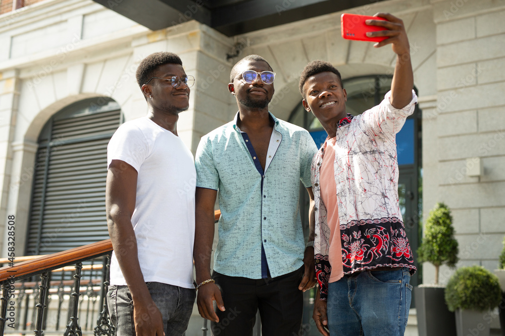 selfie photo of three african friends 