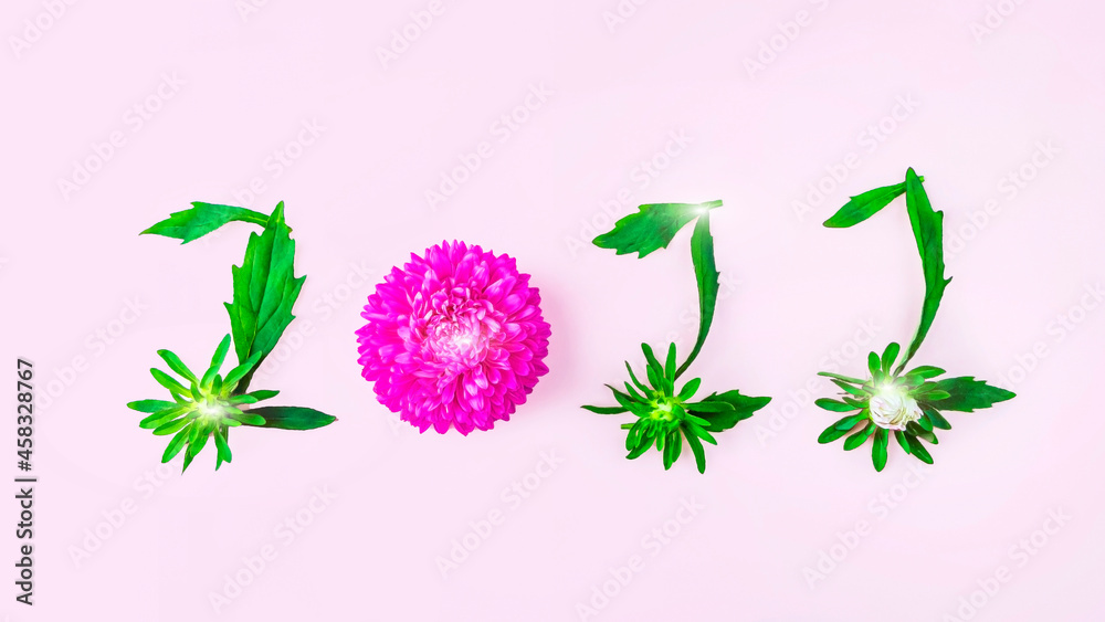 Obraz premium Floral petals and leaves in form of numbers 2022. Inscription on pink background. New year concept
