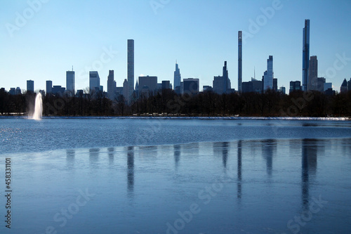 The billionaire row skyscrapers behind the Central Park reservoir in winter photo