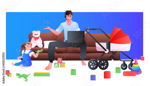 young father using laptop and spending time with little son and newborn baby in stroller fatherhood parenting concept