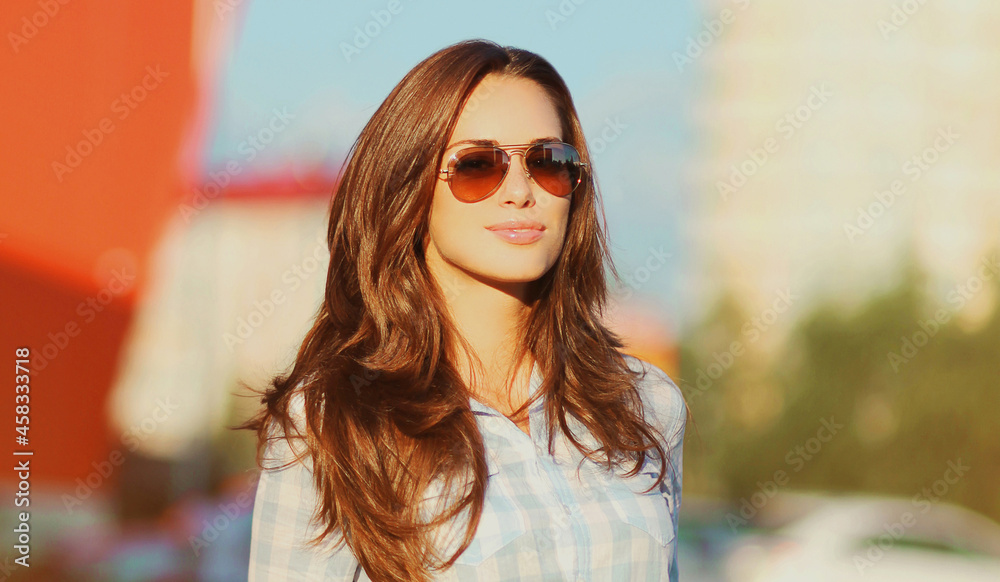 Summer portrait of beautiful young brunette woman in the city Summer portrait of beautiful young brunette woman in the city