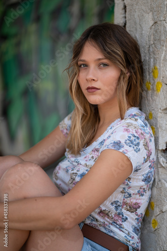 Natural Looking Young Beautiful Woman with Hazel eyes posing in abandoned building, no post editing