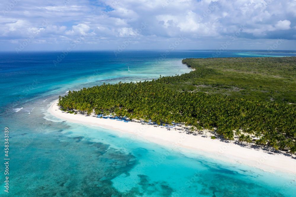 Saona island with coconut palm trees and turquoise caribbean sea. Dominican Republic. Aerial view