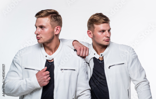 two blonde cousin. young confident brothers. confident casual models. twins brother in white