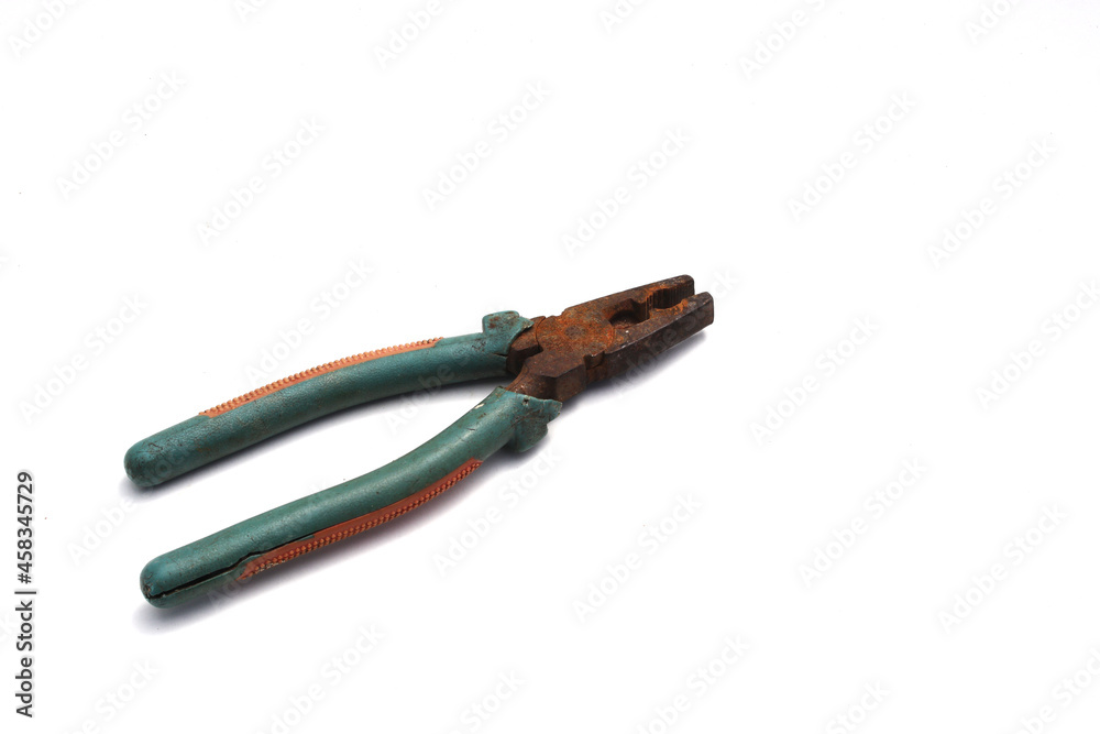 Old used rusty pliers with green grip isolated on white background. Old used rusty pliers with green grip isolated on white background.