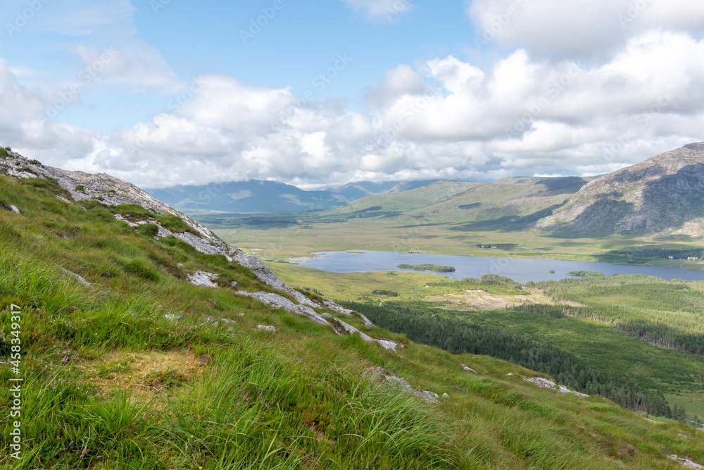 Mountains view over Lough Inagh from top of Derryclare peack.