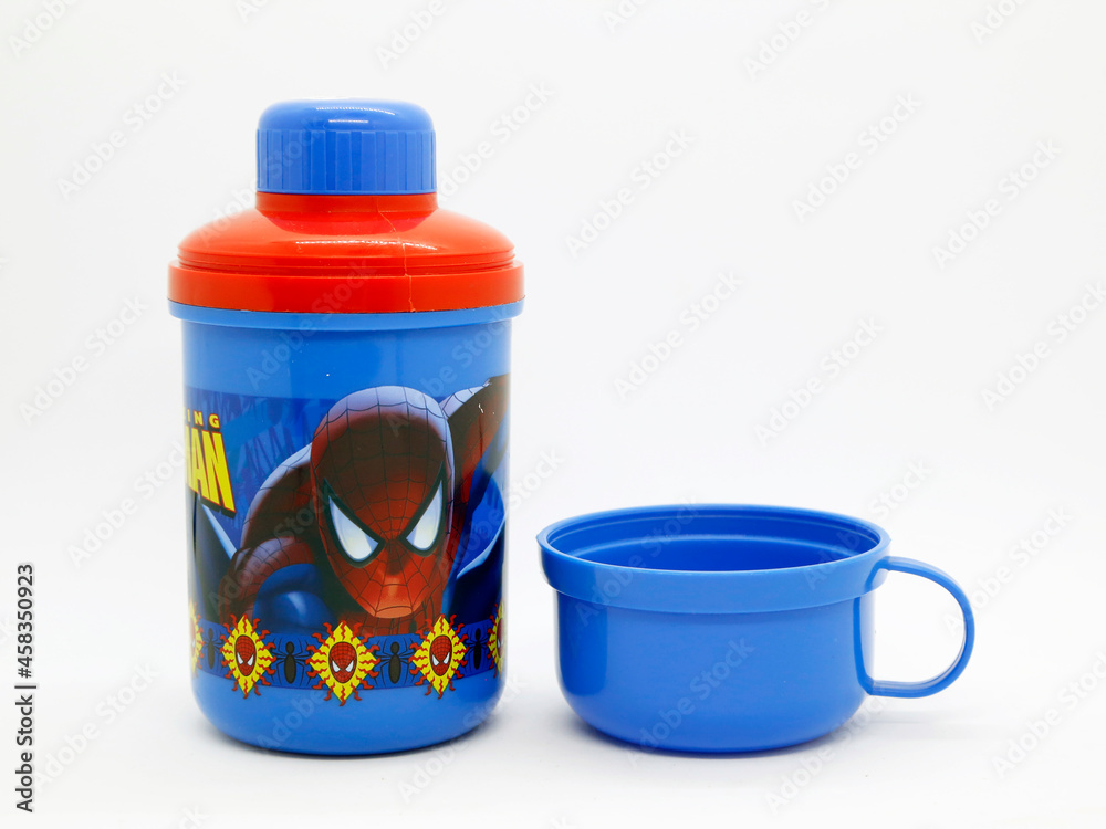 Naklejka premium Spider-Man. Spider man. Toy. Comic. Movies. Peter parker. Superheroe. Super heroe. Thermos for children's drinks. Plastic bottle with glass included. School supplies. Isolated white. Blue and red.