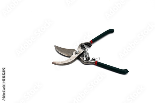 Pruning scissors (Pruning shears, Garden secateurs) with green grip isolated on white background