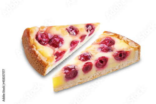 Fresh sweet cheesecake with cherries and almond sprinkles on a white isolated background
