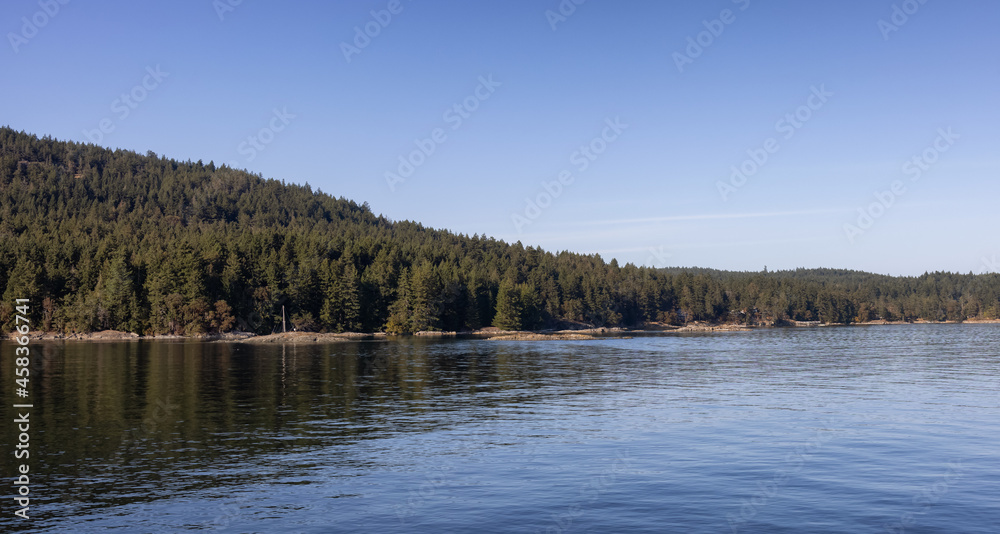 Gulf Islands on the West Coast of Pacific Ocean. Canadian Nature Landscape Background. Sunny Summer Day. Near Salt Spring Island, BC, Canada. Gulf Islands on the West Coast of Pacific Ocean. Canadian Nature Landscape Background. Sunny Summer Day. Near Salt Spring Island, BC, Canada.