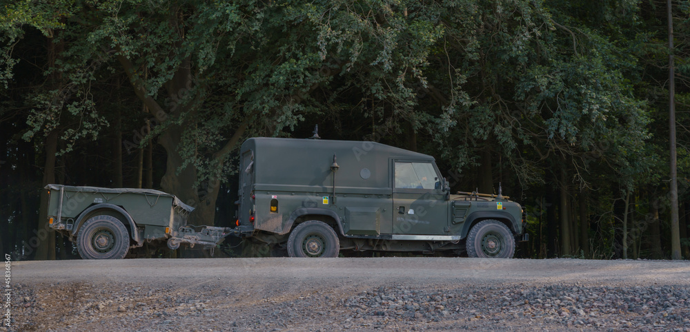British Army Land Rover Defender Wolf medium utility vehicle on military exercise Salisbury Plain, Wiltshire, UK