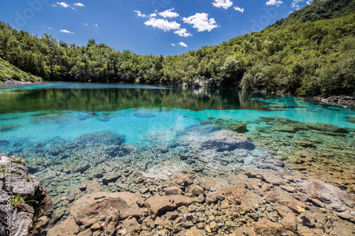 Serene landscape of the turquoise Lake Cornino in Italy photo