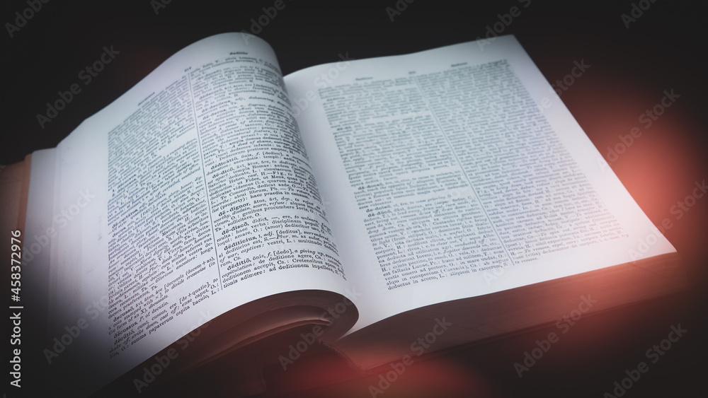 Fototapeta premium Ancient Greek, Latin Dictionary with red light, Education, knowledge concept