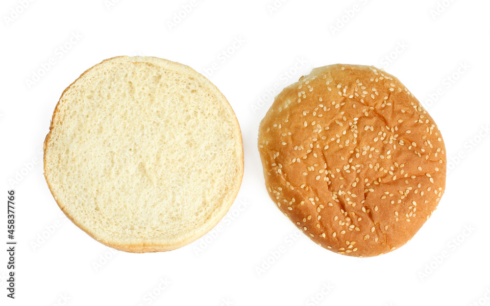 Sliced burger bun with sesame seeds above. Isolated on white background Sliced burger bun with sesame seeds above. Isolated on white background