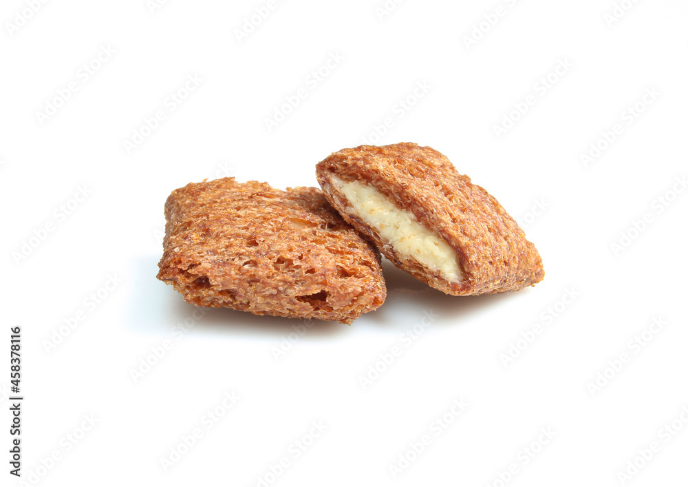 Crunchy chocolate pillows filled with milky cream isolated on white bbackground. Bitten treats Crunchy chocolate pillows filled with milky cream isolated on white bbackground. Bitten treats