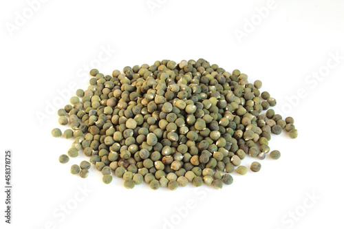 Group of dry okra seeds isolated on white background photo