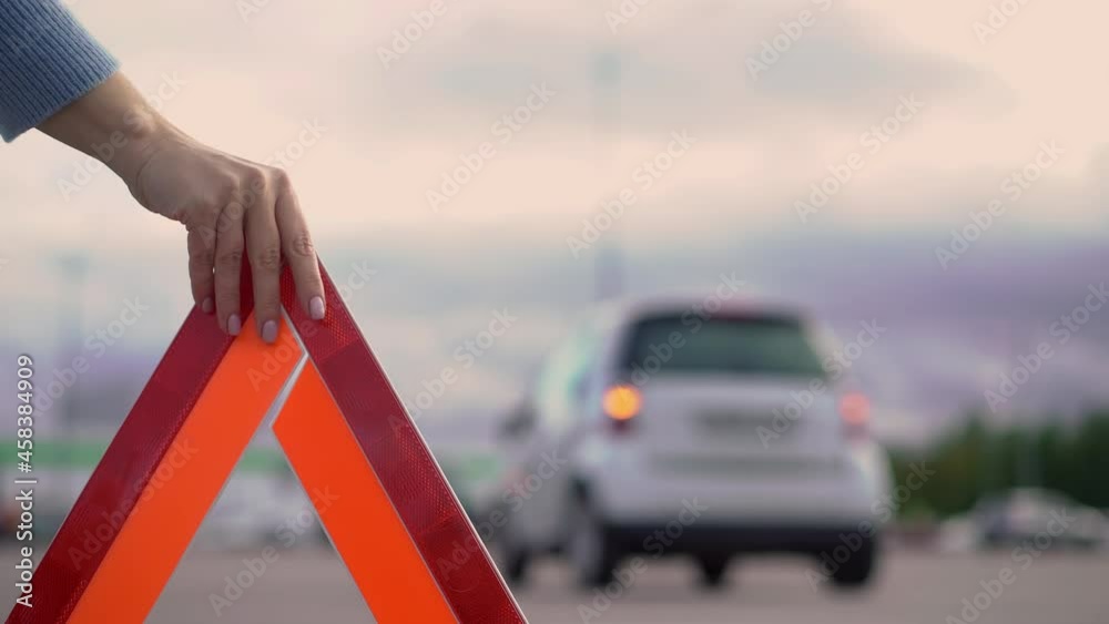 Warning triangle. A car with a flashing emergency light in the parking accident. Warning triangle. A car with a flashing emergency light in the parking accident.