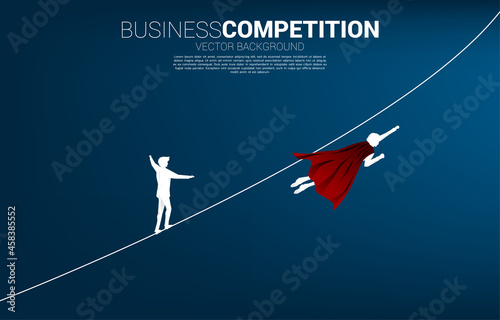 Silhouette of businessman flying compete with the man walking on rope.Concept for business risk and career path