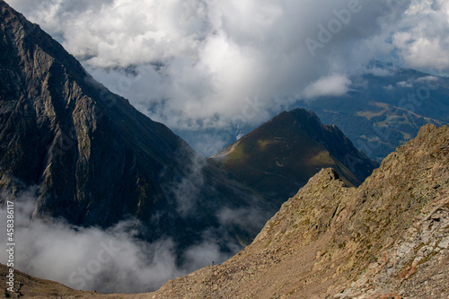 The view of French Alps from the hiking trail between Nid d'Aigle and Refuge de Tete Rousse, September, France photo