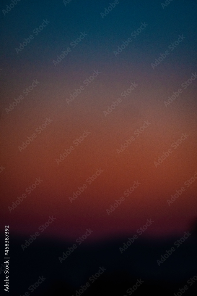 texture of a multicolored sunset with blur during a summer evening in Liguria
