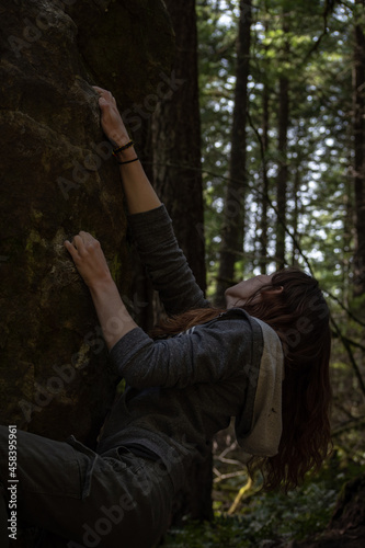 Woman climbing on a tree