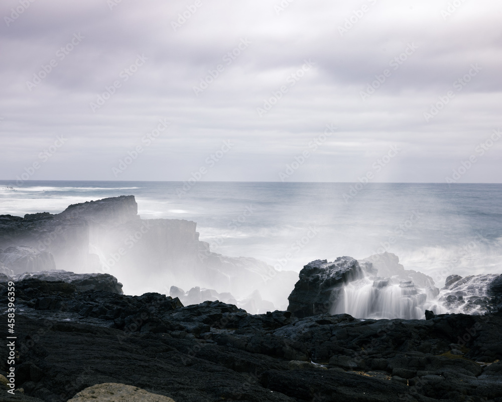 Crashing waves against rocks in Iceland