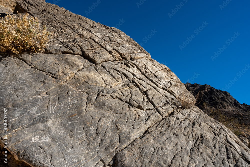 Graffiti And Petroglyphs In The Bright Morning Sun of Titus Canyon