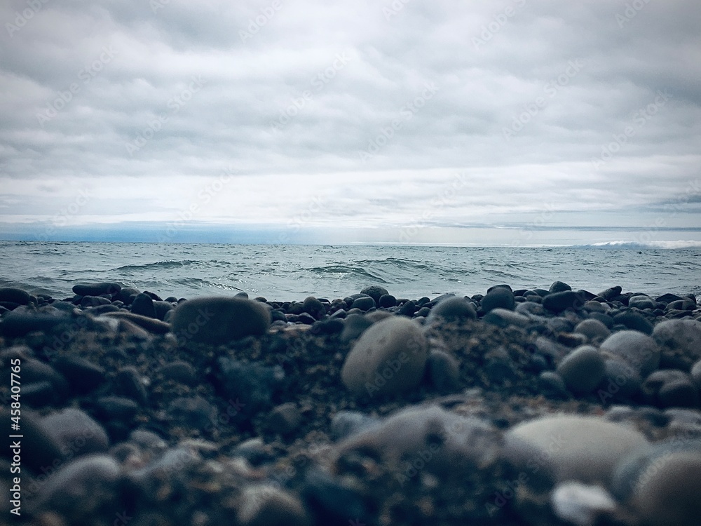 Rocks near ocean under dark cloud sky
Rocks near ocean under dark cloud sky