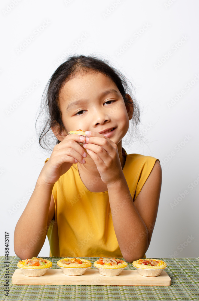 asian baby girl felling good for tasty dessert asian baby girl felling good for tasty dessert