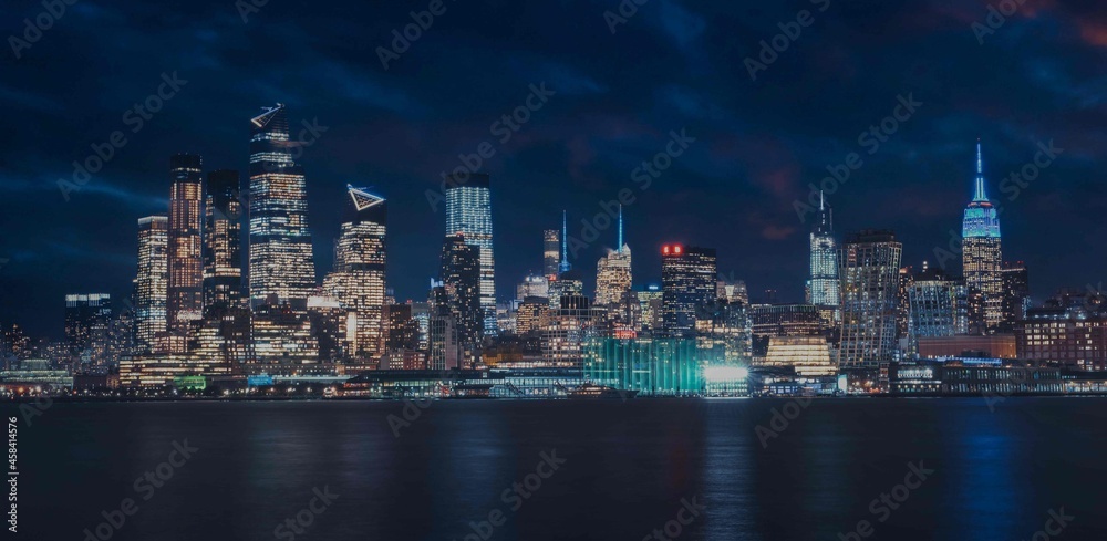 new York city skyline at night beautiful reflections skyscrapers buildings sea 