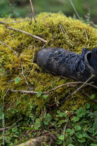 Boots on the moss of the misty mountains cold of Choachi, Colombia photo