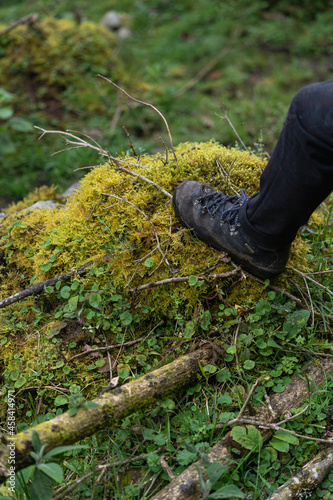 Boots on the moss of the misty mountains cold of Choachi, Colombia