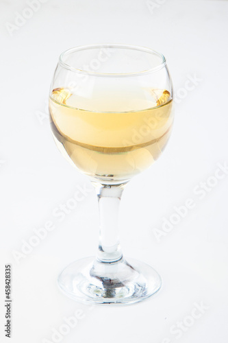 white wine in transparent glasses on a white background