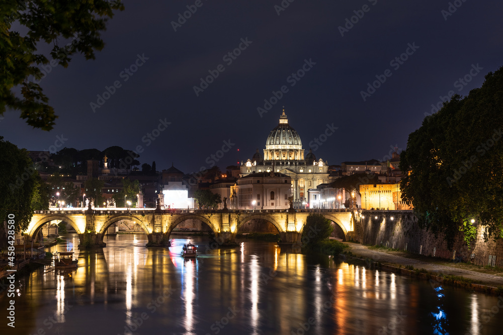 Vatican Cathedral of St. Peter and illuminated neighboring buildings on a summer evening