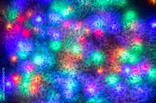 Multicolored lights on the surface of the faux fur