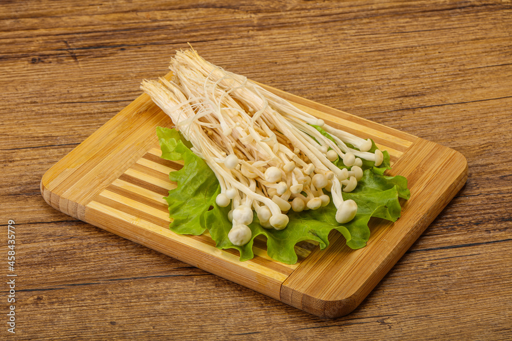 Raw Enoki mushrooms for cooking