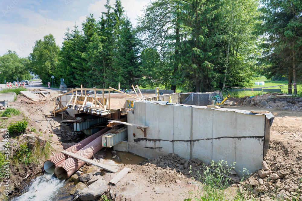 Bridge reconstruction. Panels with reinforcing steel bars on top of concrete girders prior to pouring concrete over reinforcing steel to provide strength and integrity to the bridge to support traffic Bridge reconstruction. Panels with reinforcing steel bars on top of concrete girders prior to pouring concrete over reinforcing steel to provide strength and integrity to the bridge to support traffic