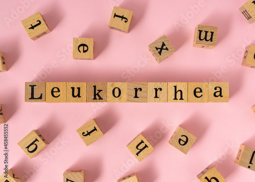 Leukorrhea word on wooden cube. photo