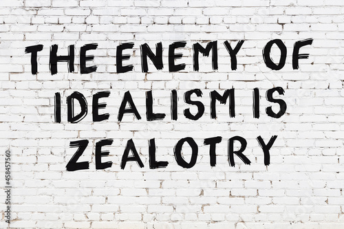 Photography Black painted inscription of smart quote on white brick wall