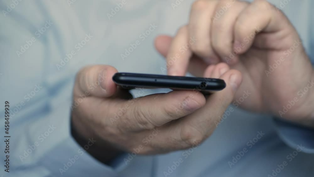 Man Using a Cellphone. Businessman Texting on Mobile Phone. Browsing Internet Pages using a Smartphone. Man Using a Cellphone. Businessman Texting on Mobile Phone. Browsing Internet Pages using a Smartphone.
