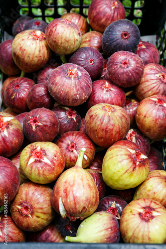 ripe fresh figs fruit in basket background