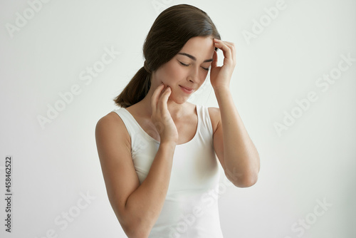 woman with closed eyes headache emotions negative